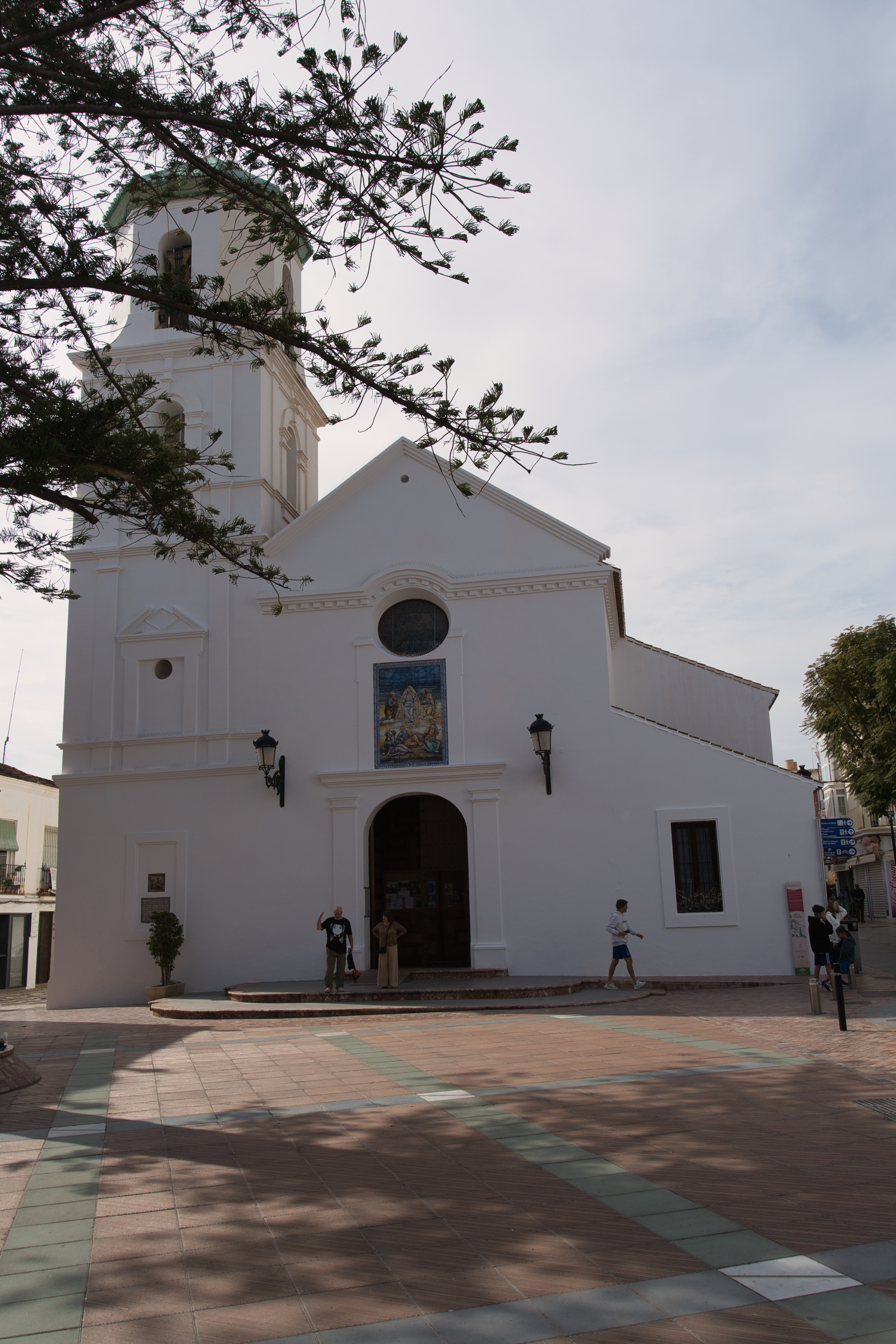 The white facade and bell tower of Iglesia El Salvador in Nerja