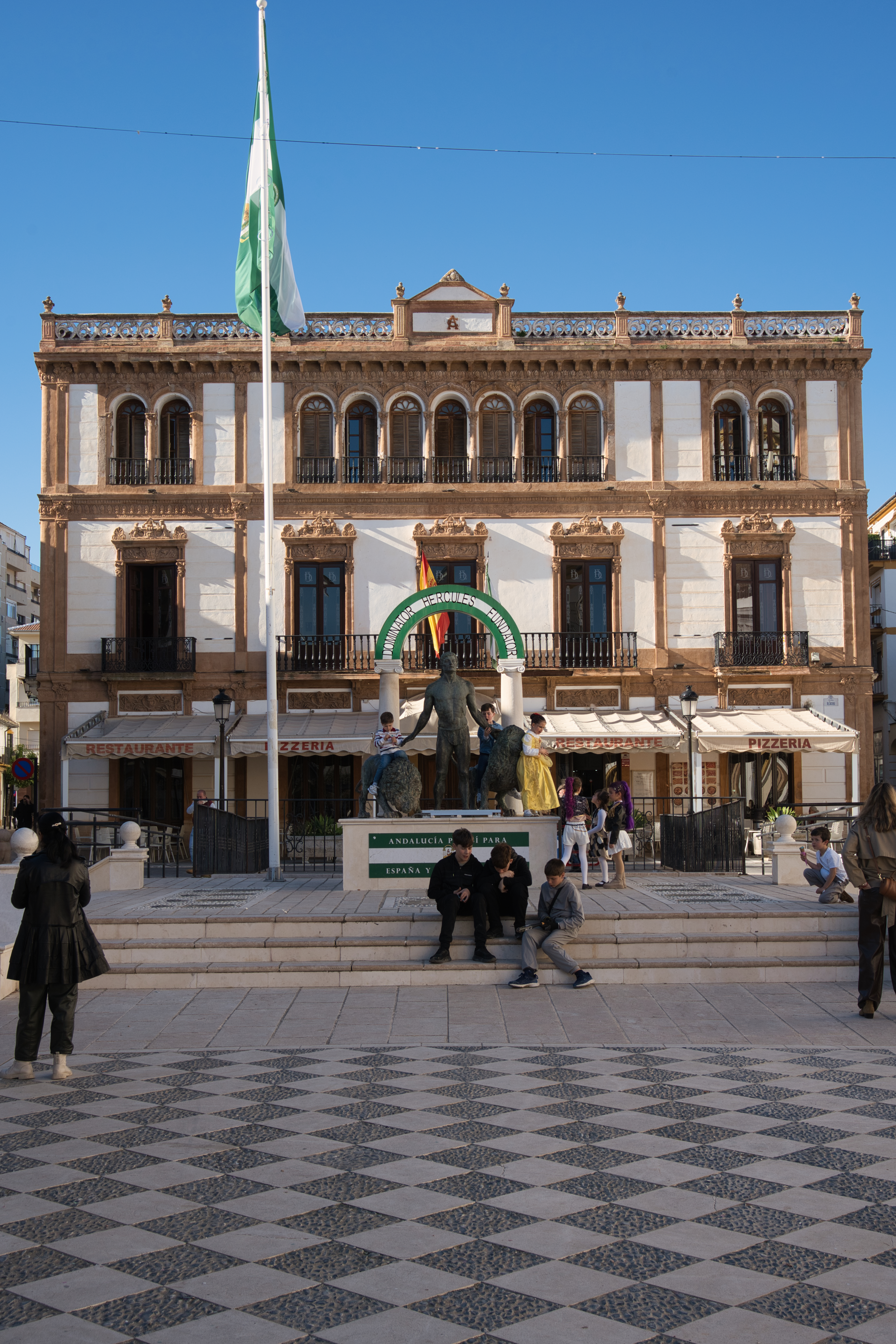 The Hercules statue and checkered pavement of Plaza del Socorro in Ronda