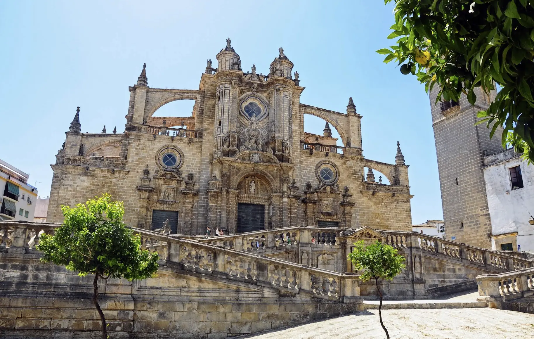 White hilltop buildings and church tower in Jerez de la Frontera, a popular day trip from Nerja