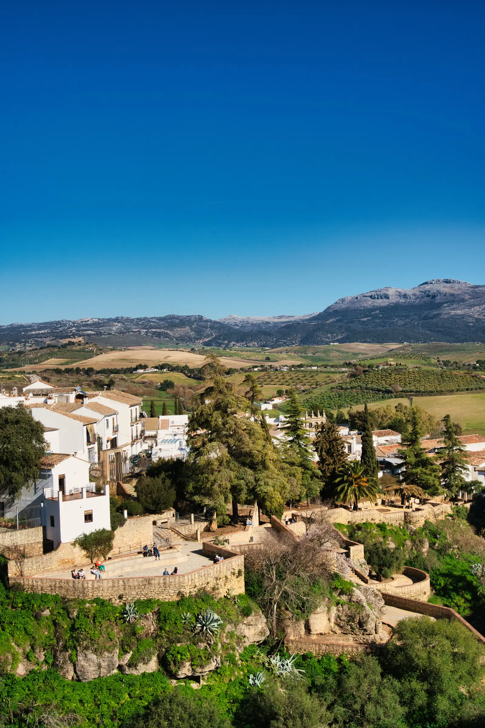Old houses clinging to the cliffs below Ronda's bridges.