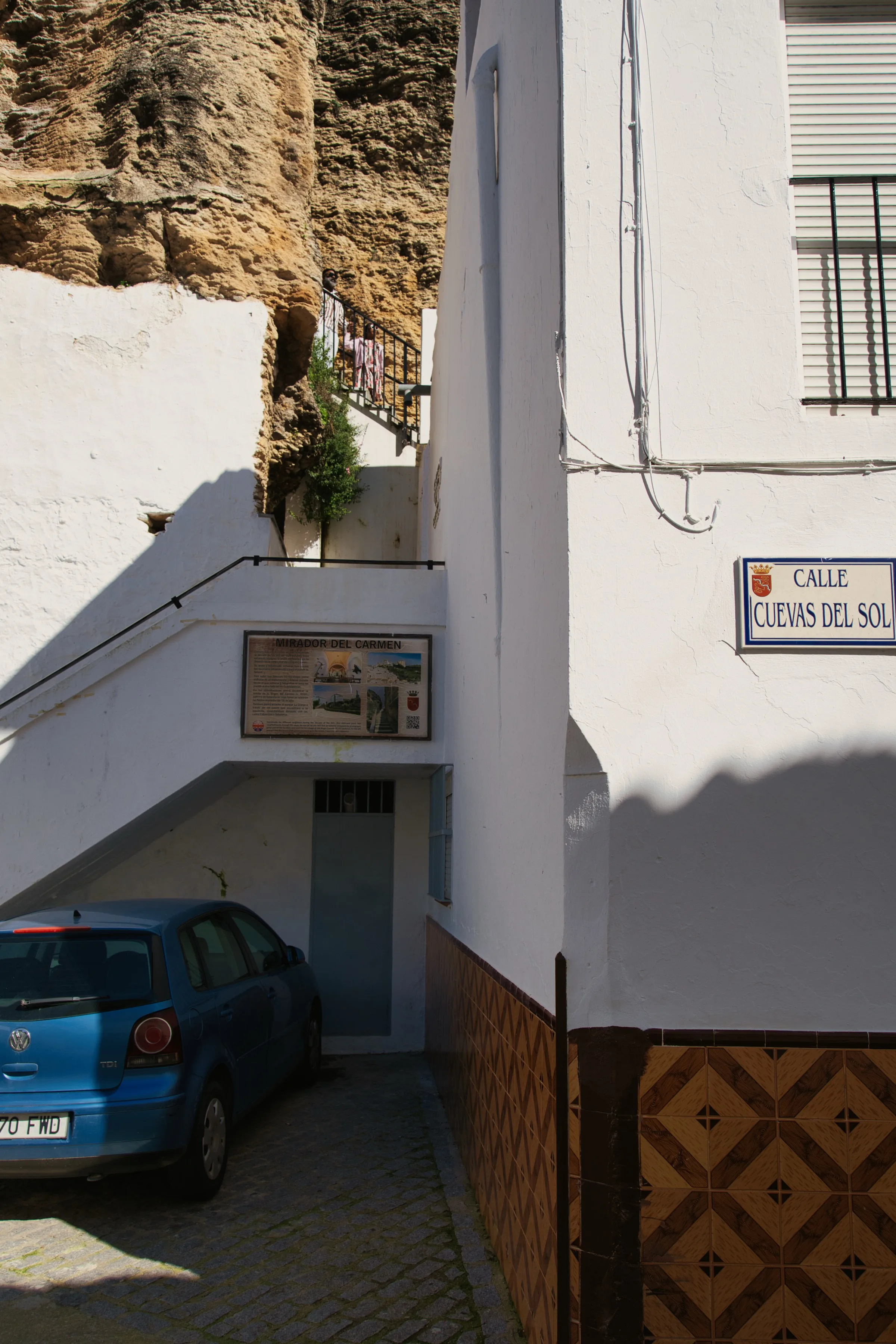Calle Cuevas del Sol, the street where the houses sit under the rock overhang