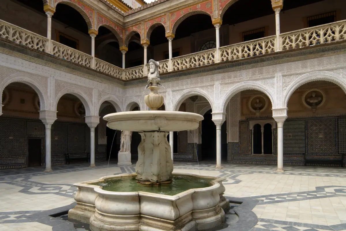 Mudejar arched corridor and intricate tilework inside the Royal Alcazar