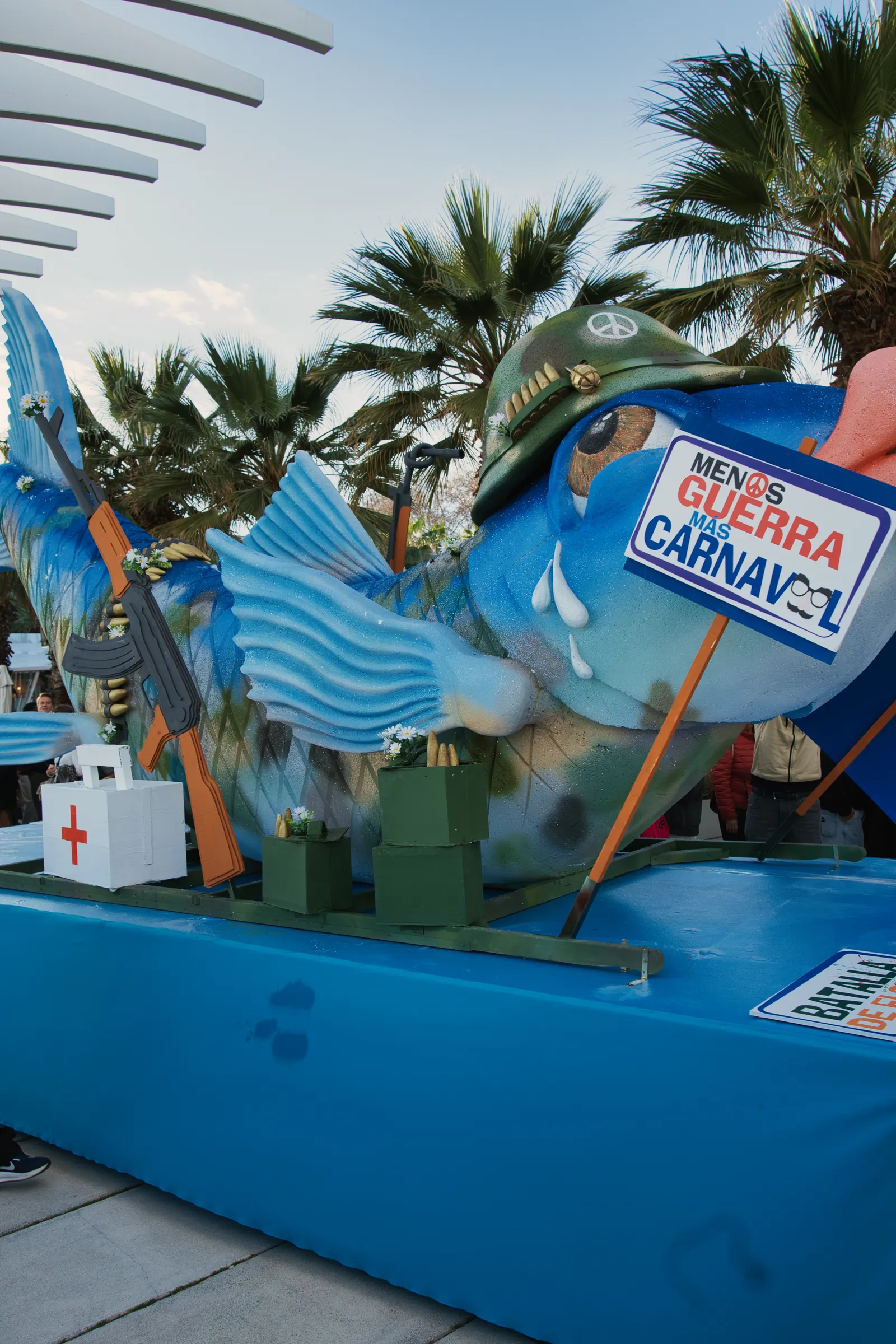 Sardine effigy being carried in procession at El Entierro de la Sardina carnival finale