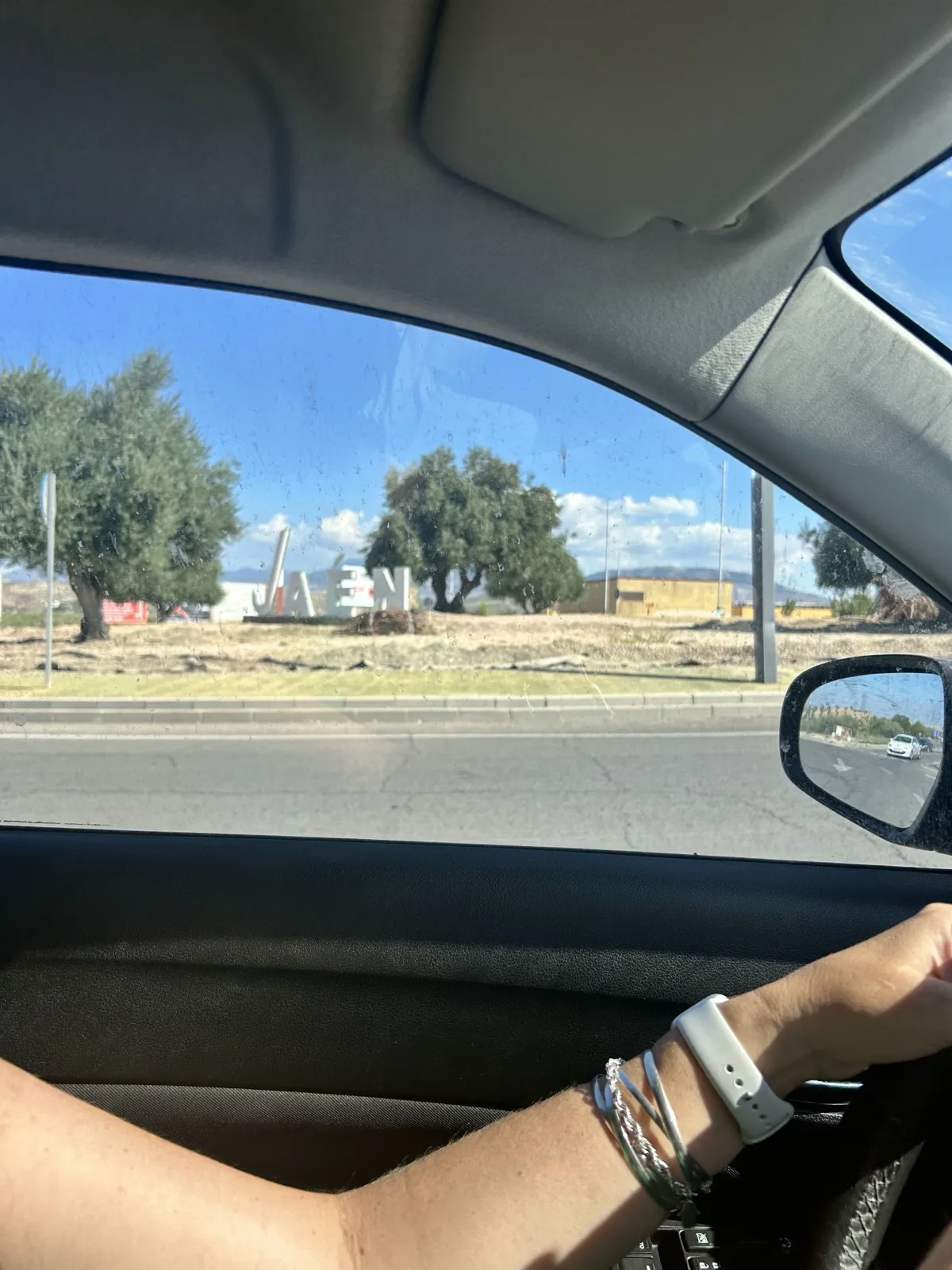 Driving into Jaén, arm resting on the car door