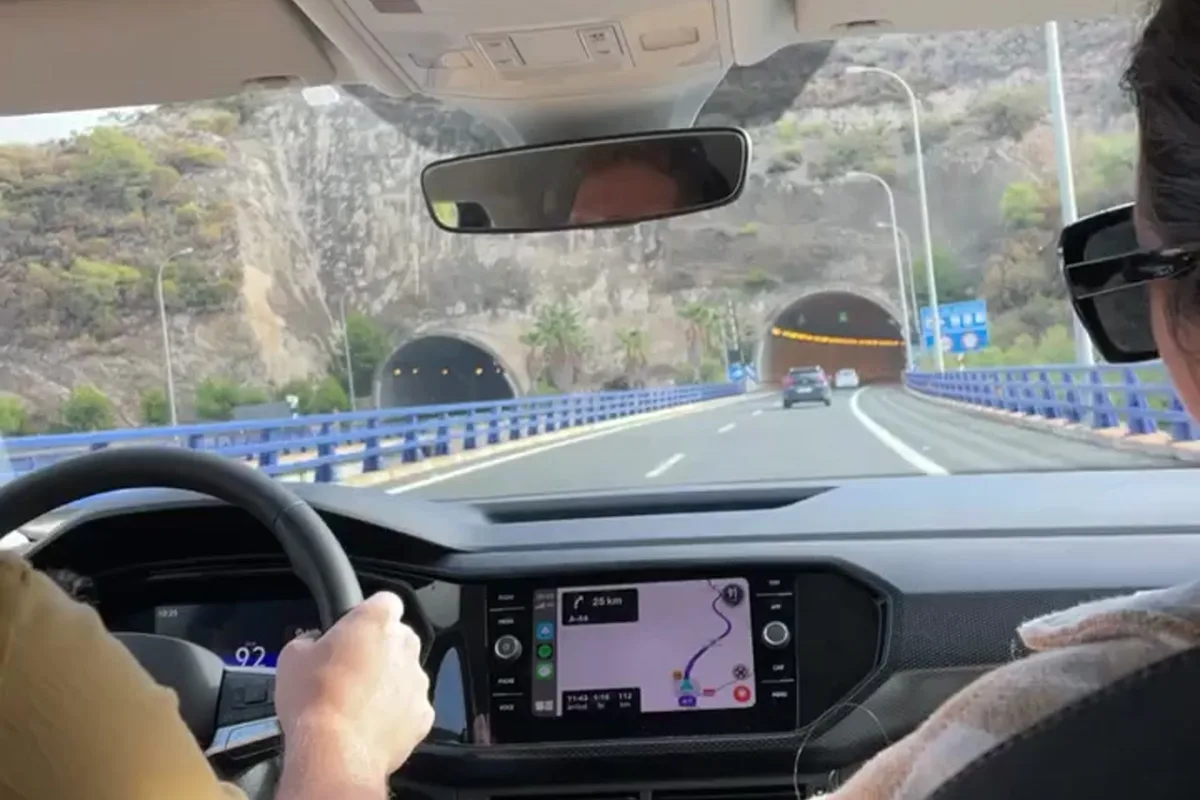 Heidi in the passenger seat as the car heads into a tunnel on a Spanish motorway