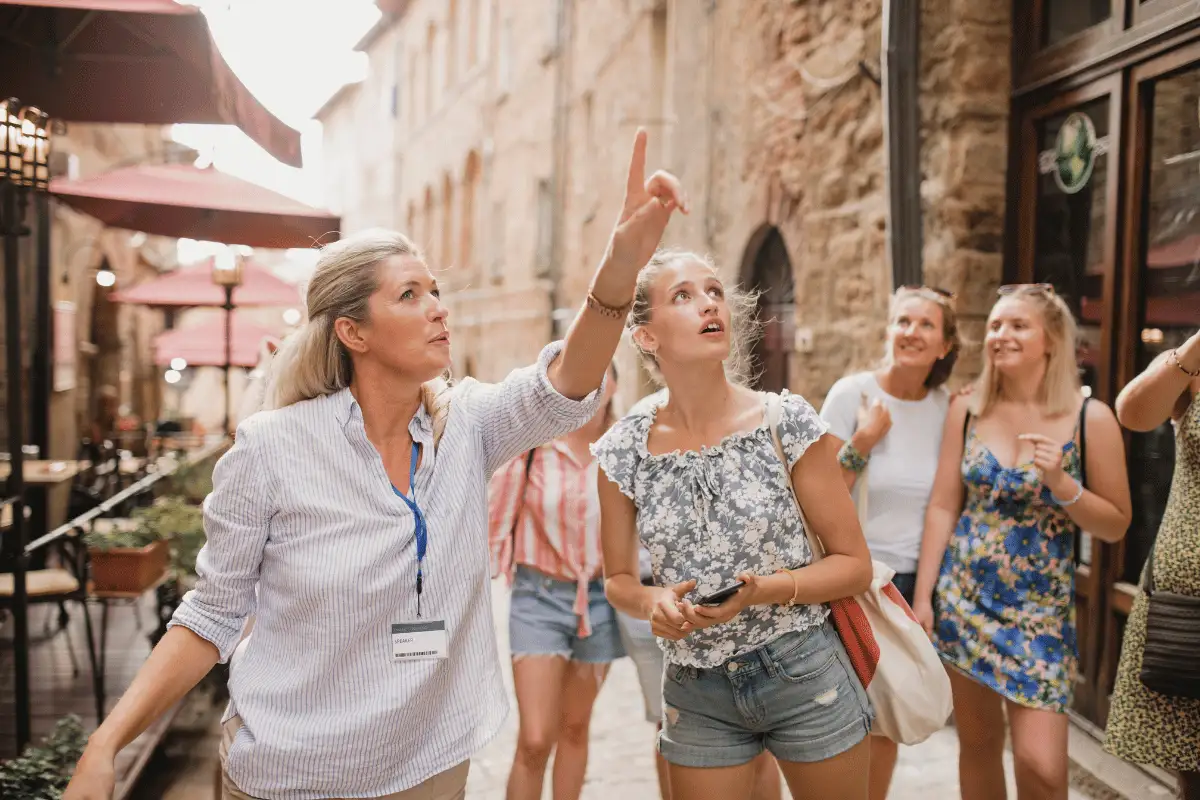 Tour guide leading a small group through a historic Spanish city