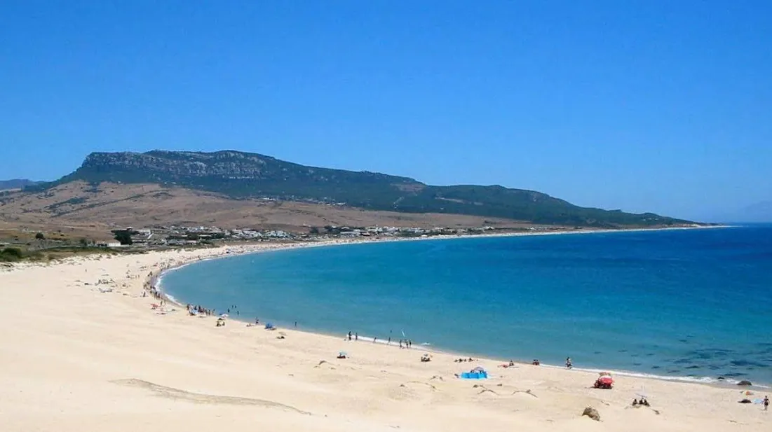 Playa de Bolonia near Tarifa, wide natural Atlantic beach with pale sand and a dune