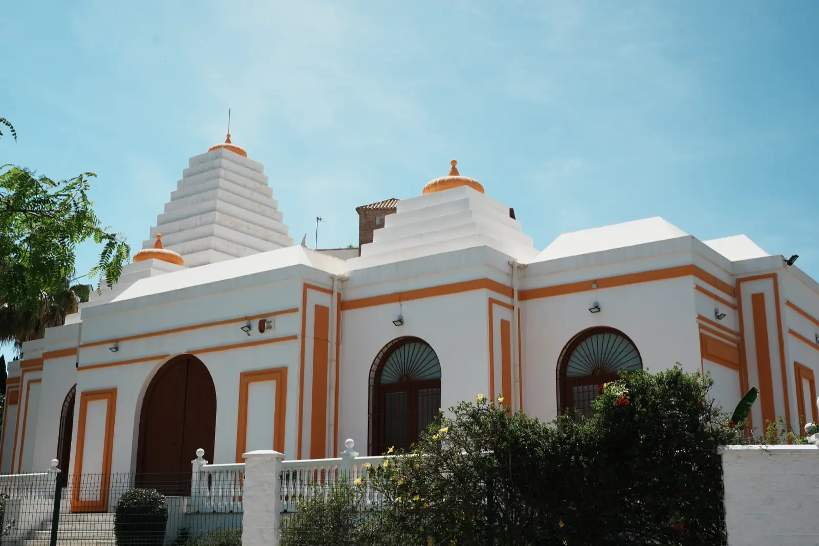 The Hindu Temple in Benalmadena, white and orange building with carved tower