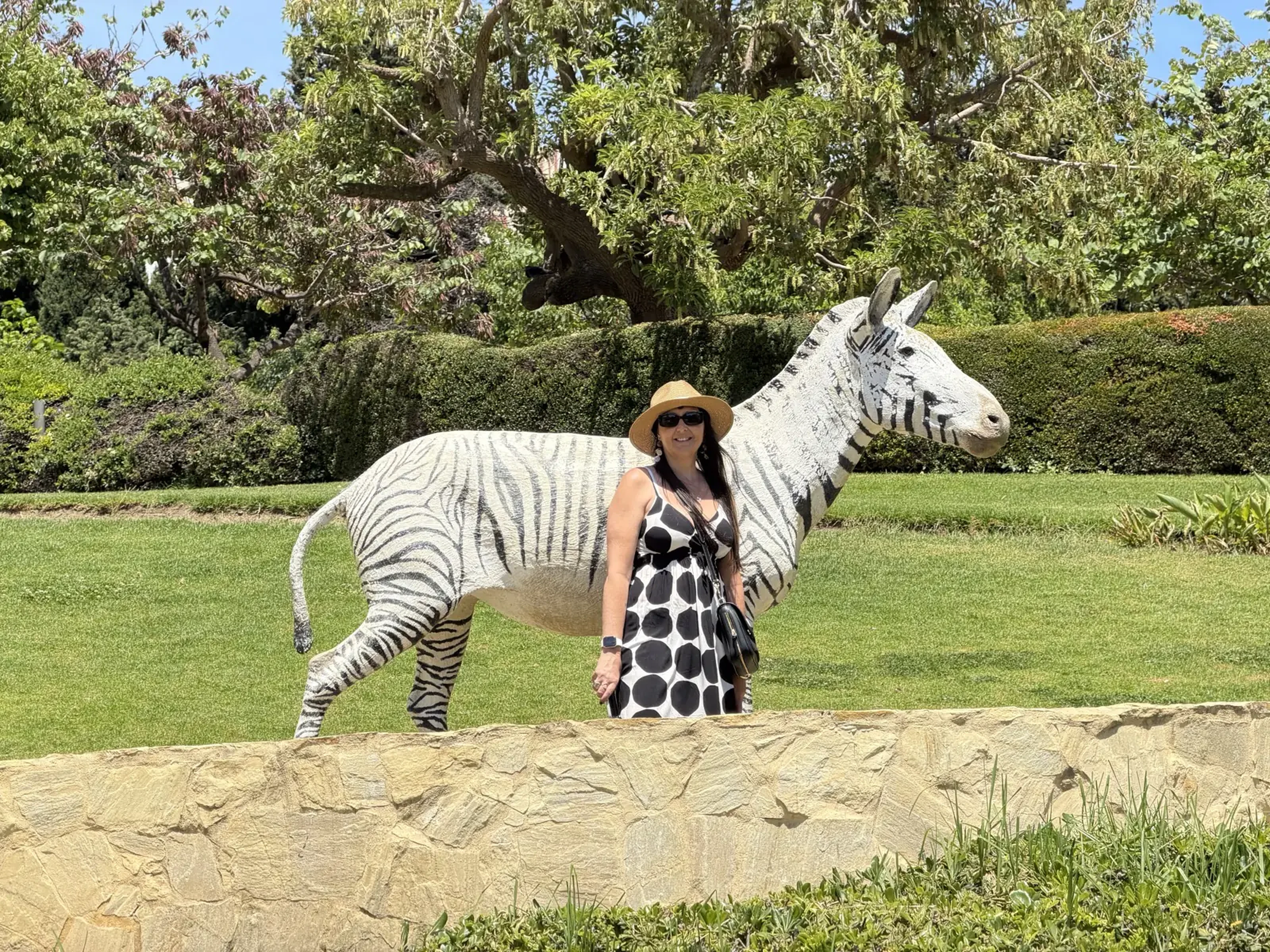 Heidi taking a selfie with the zebra statue in Parque de la Paloma