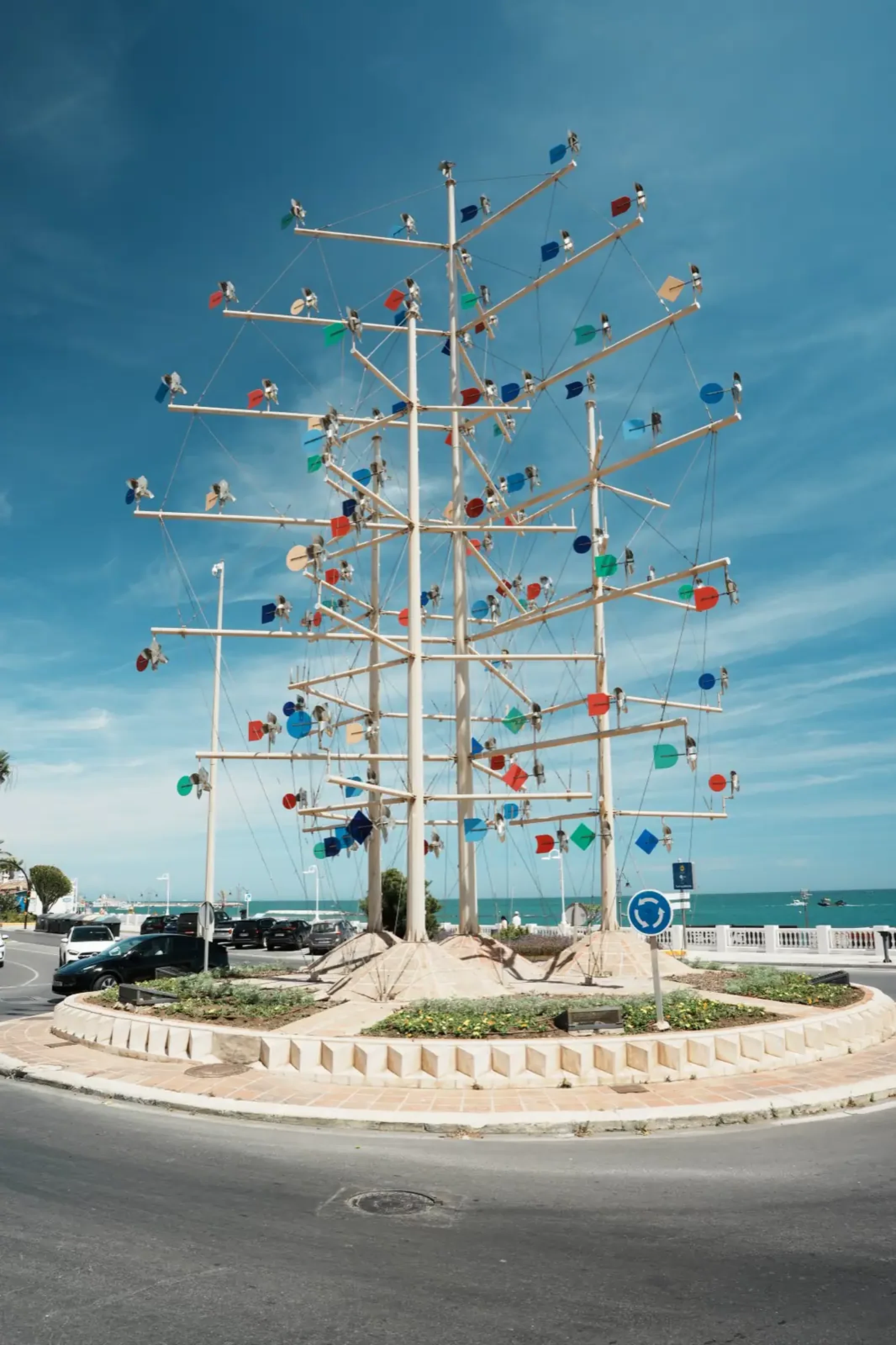 The Rotonda de los Molinillos roundabout sculpture in Benalmadena with the sea behind