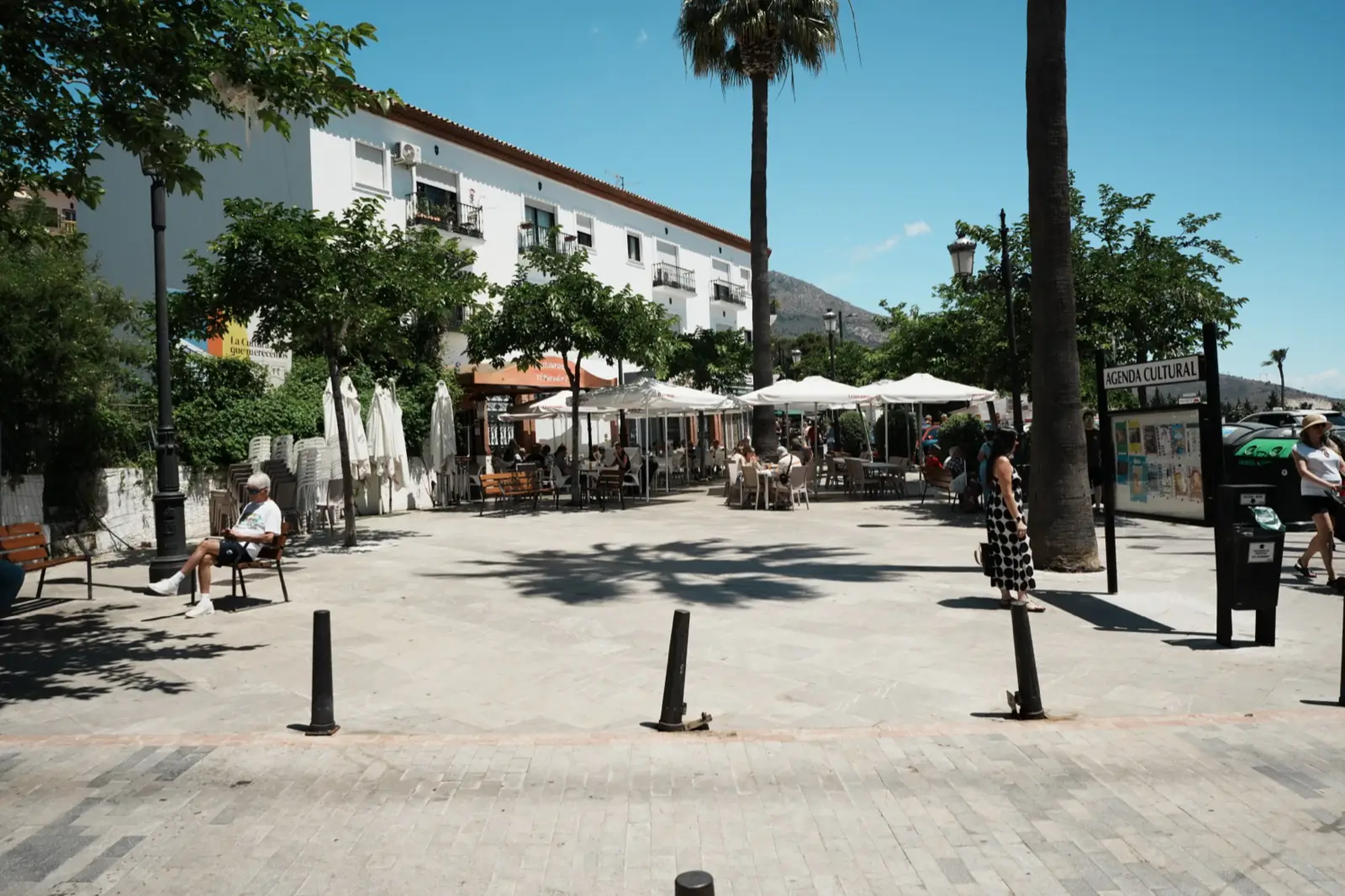 Café terraces on Plaza Tres Culturas in Benalmadena Pueblo on a sunny day
