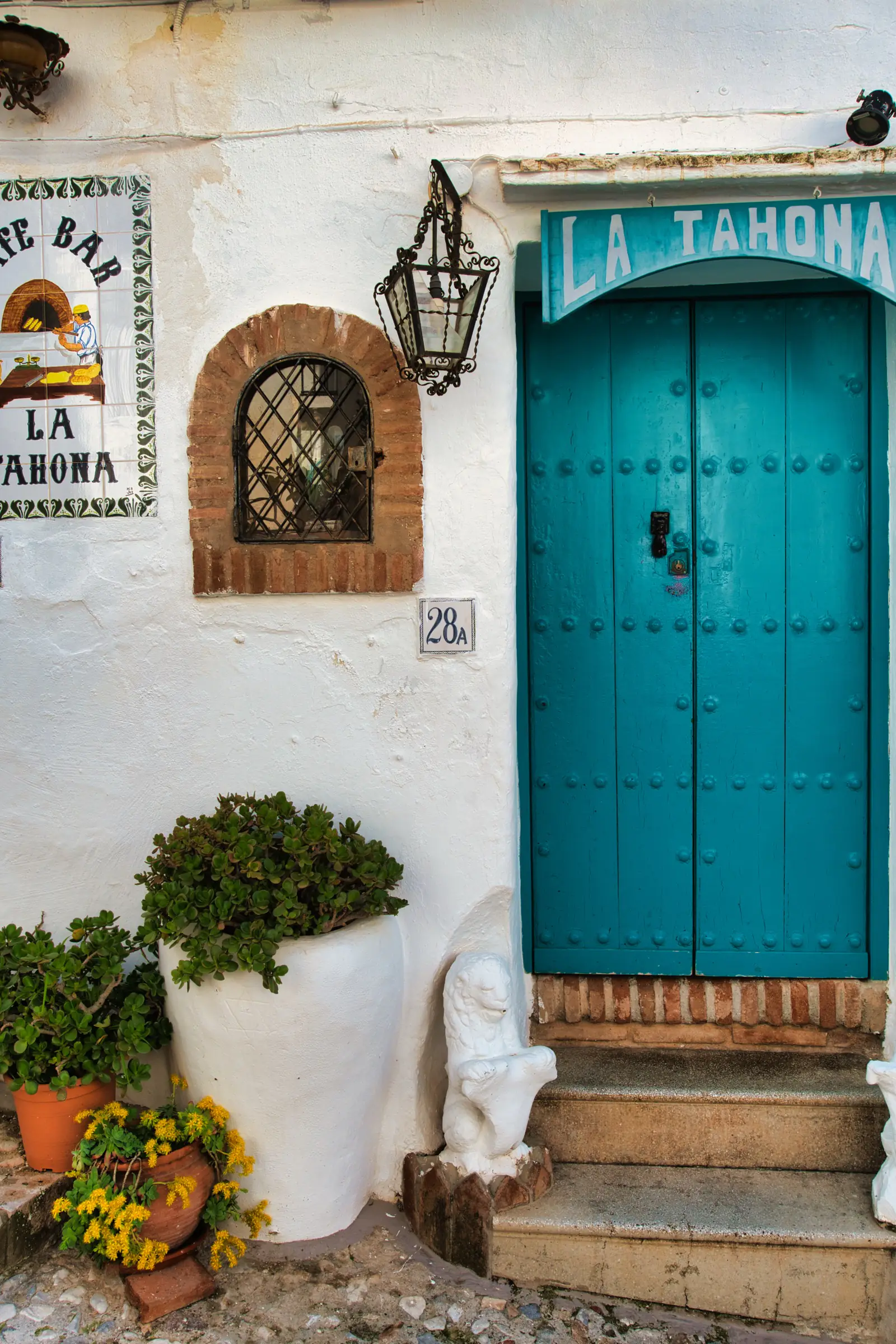 Blue door and flowers in Frigiliana