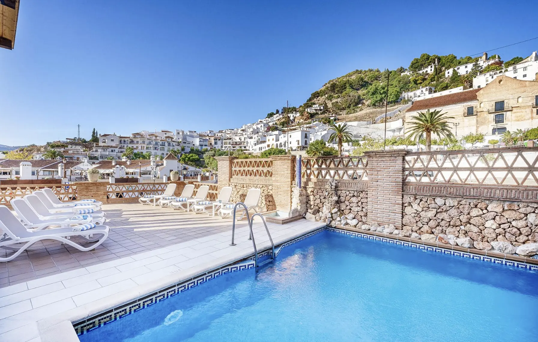 Hotel Villa Frigiliana with pool and mountain views.