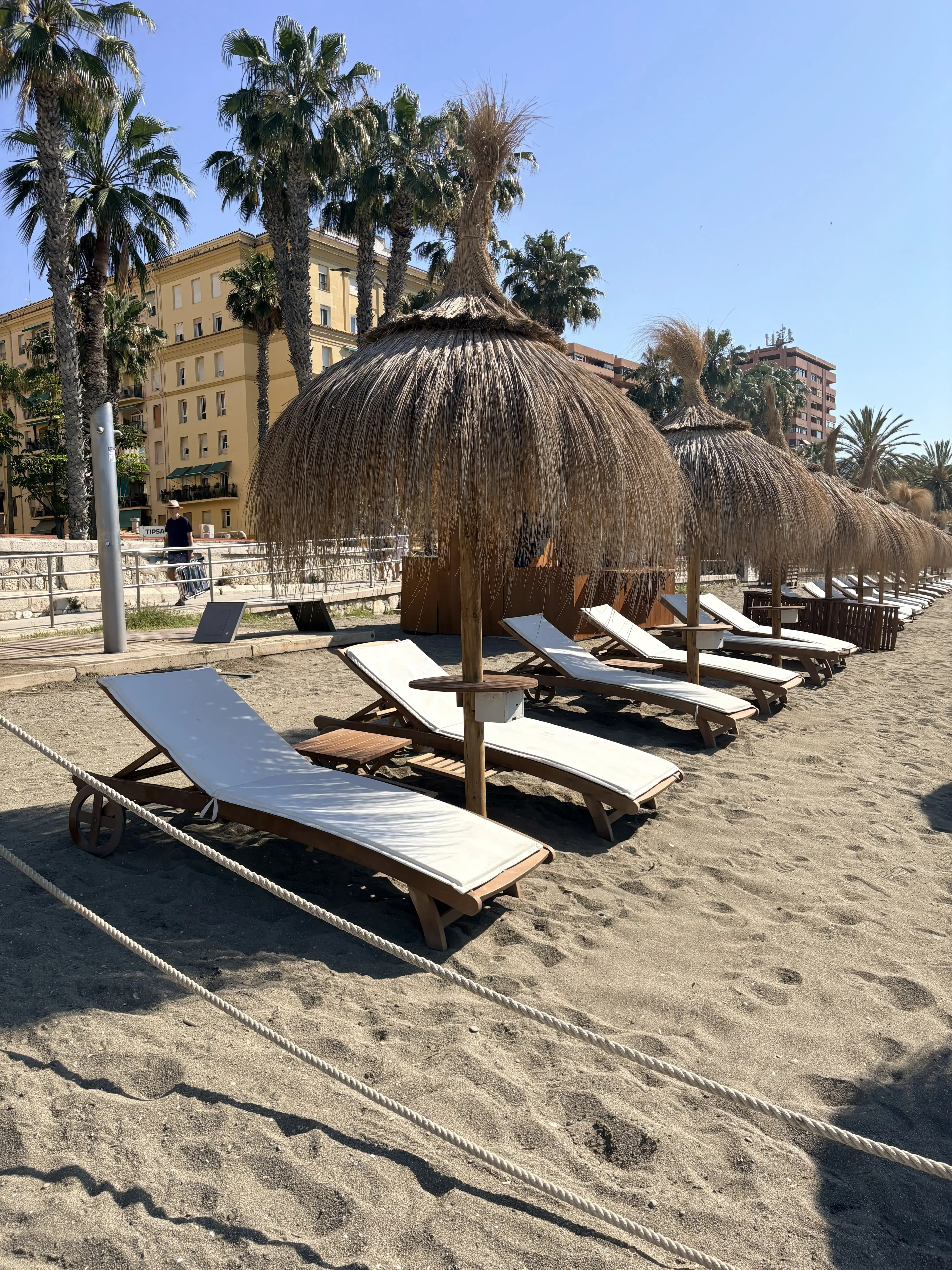 Málaga beach on a sunny day with the sea in the background