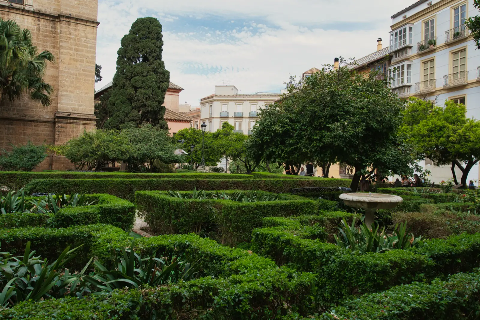 Málaga Cathedral and gardens on a clear spring day