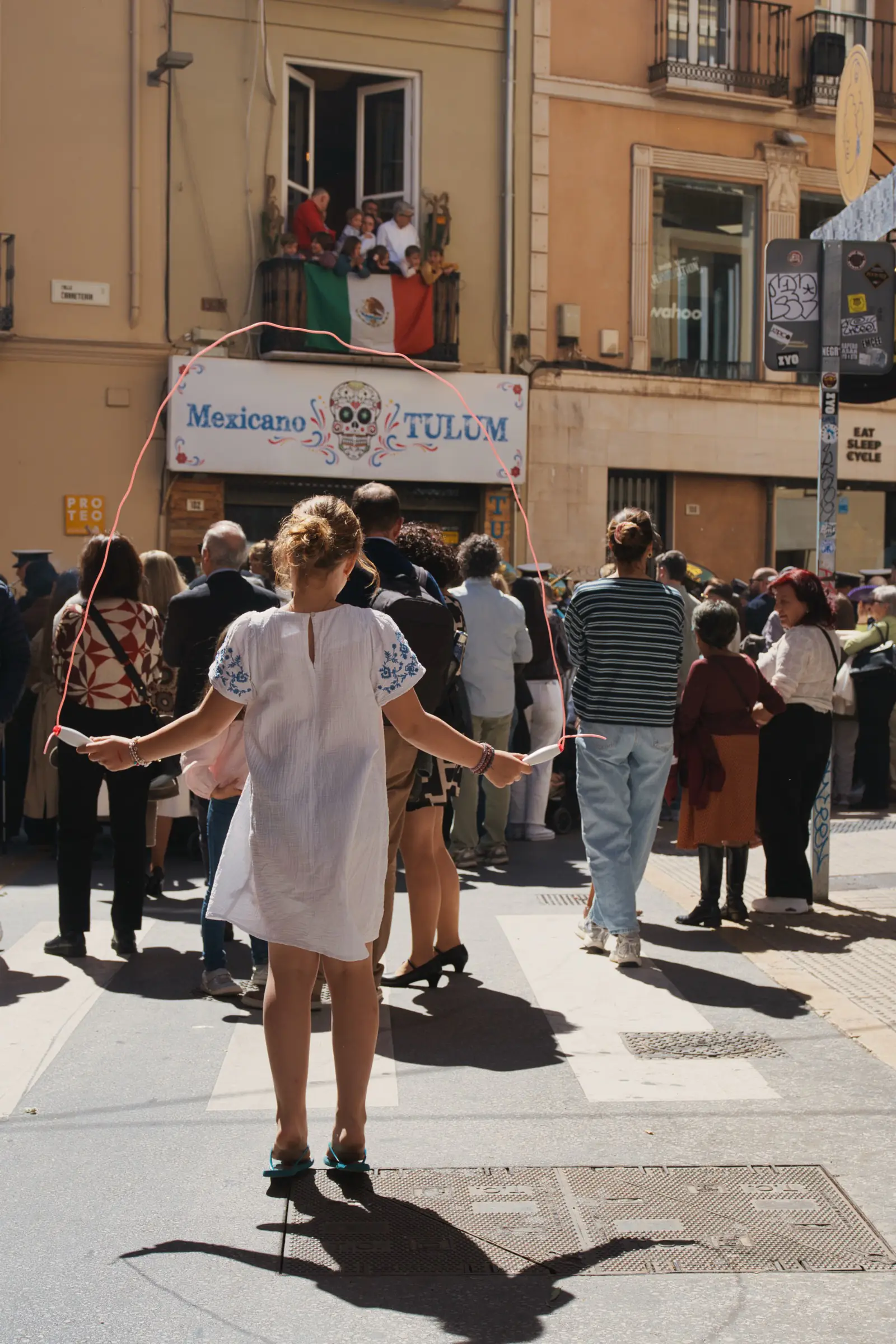 People skipping during Semana Santa in Malaga.