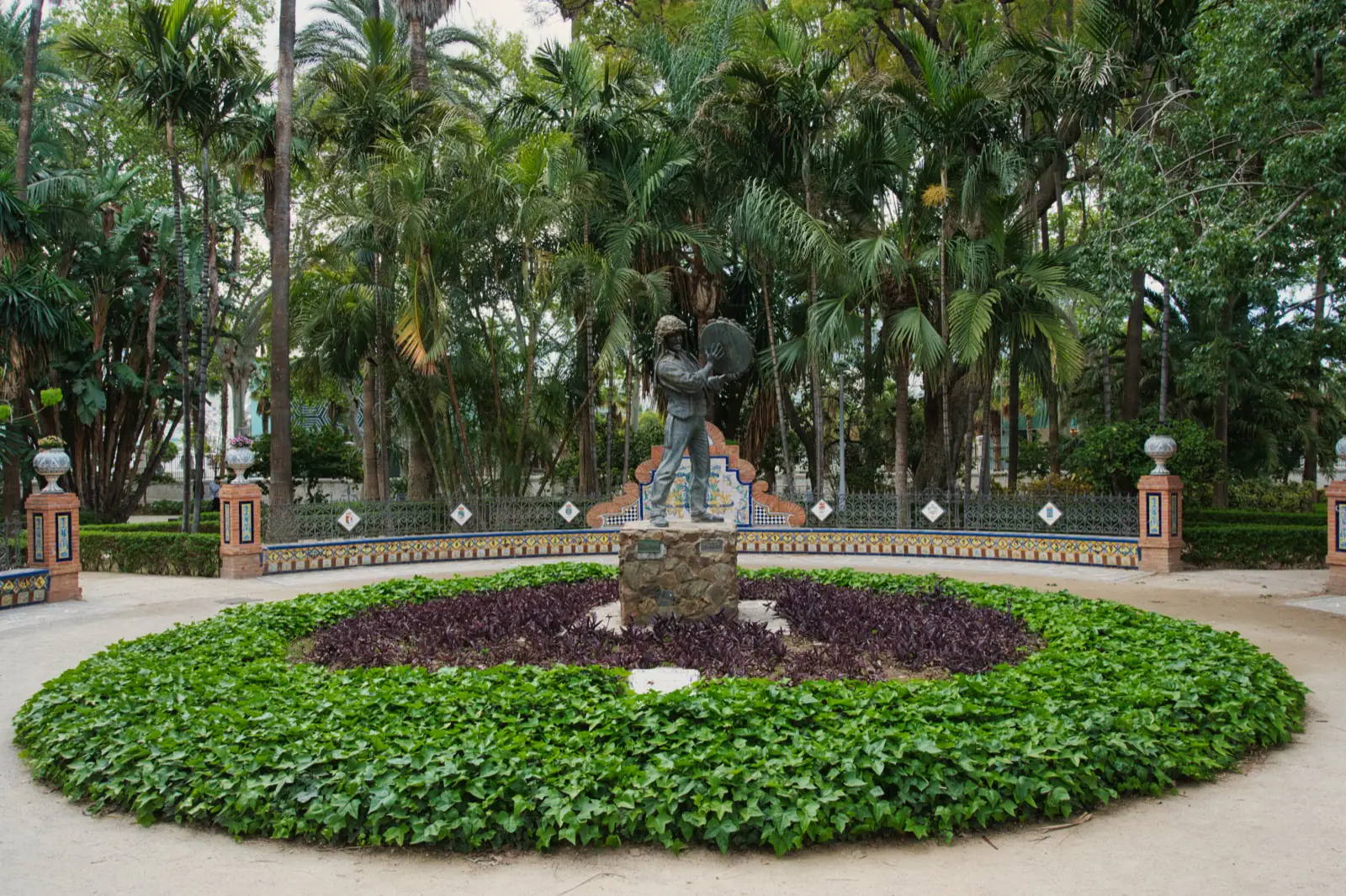 Statue in the Parque de Málaga on a spring day