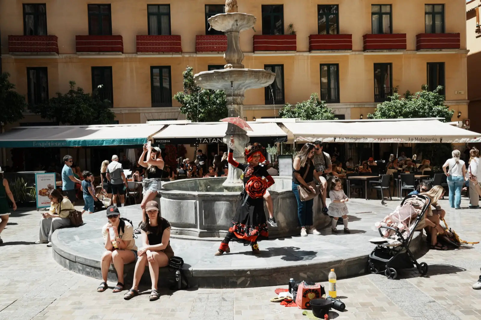 Street performer entertaining a crowd in Malaga's old town