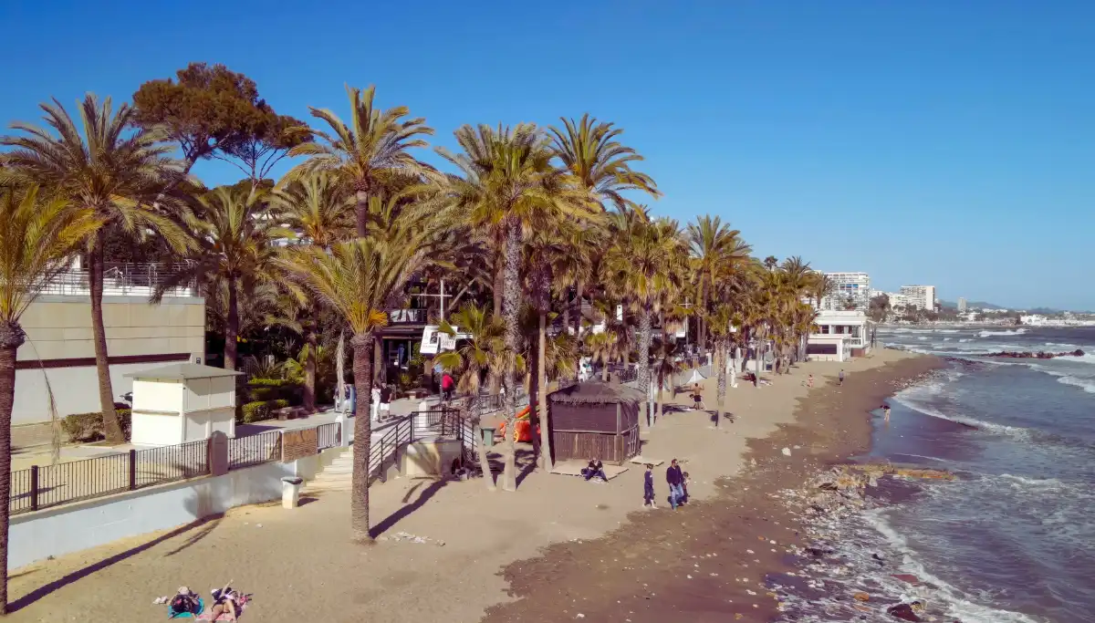 Walking the Golden Mile promenade between Marbella Old Town and Puerto Banus