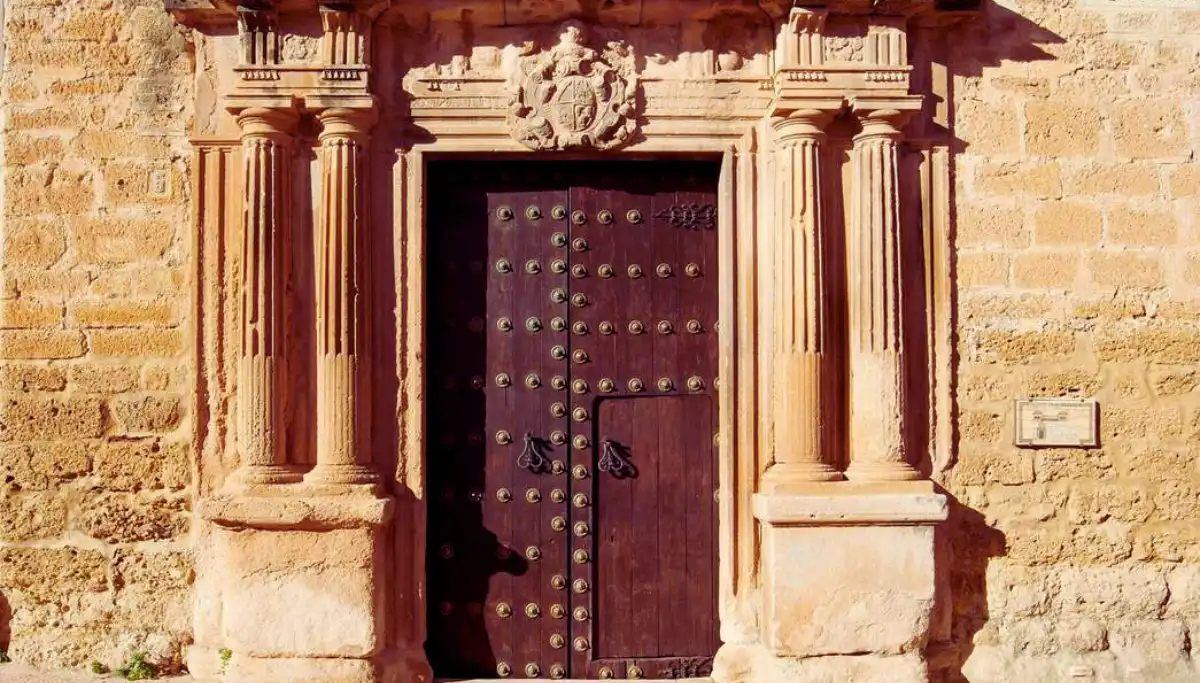 Old wooden door in the historic streets of Ronda