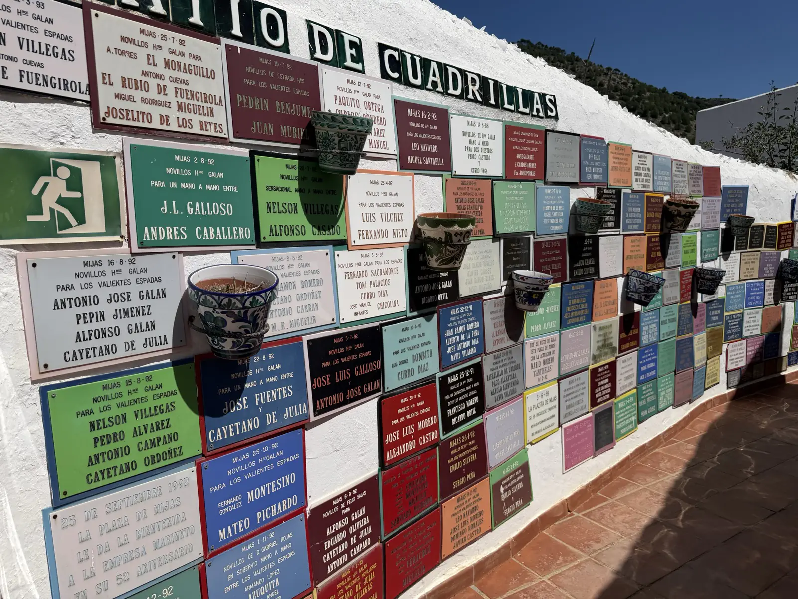 Hand-painted azulejo tiles on the historic Wall of Fame inside the Mijas Pueblo bullring
