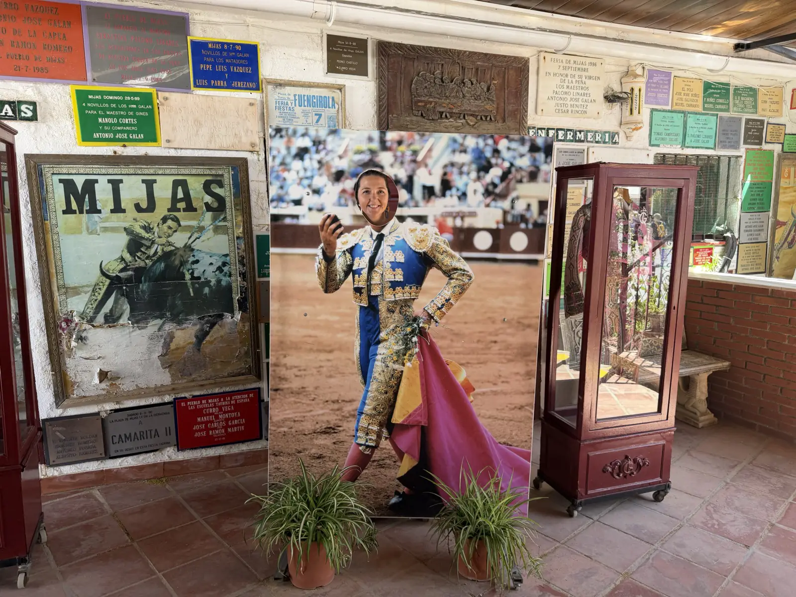 Posing with a matador's cape inside the Mijas Pueblo bullring