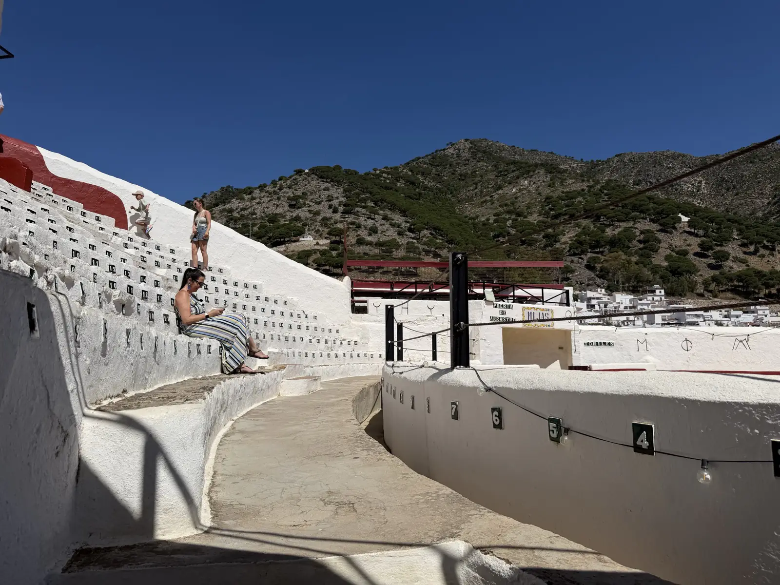 Heidi sitting in the stands of the Mijas Pueblo bullring