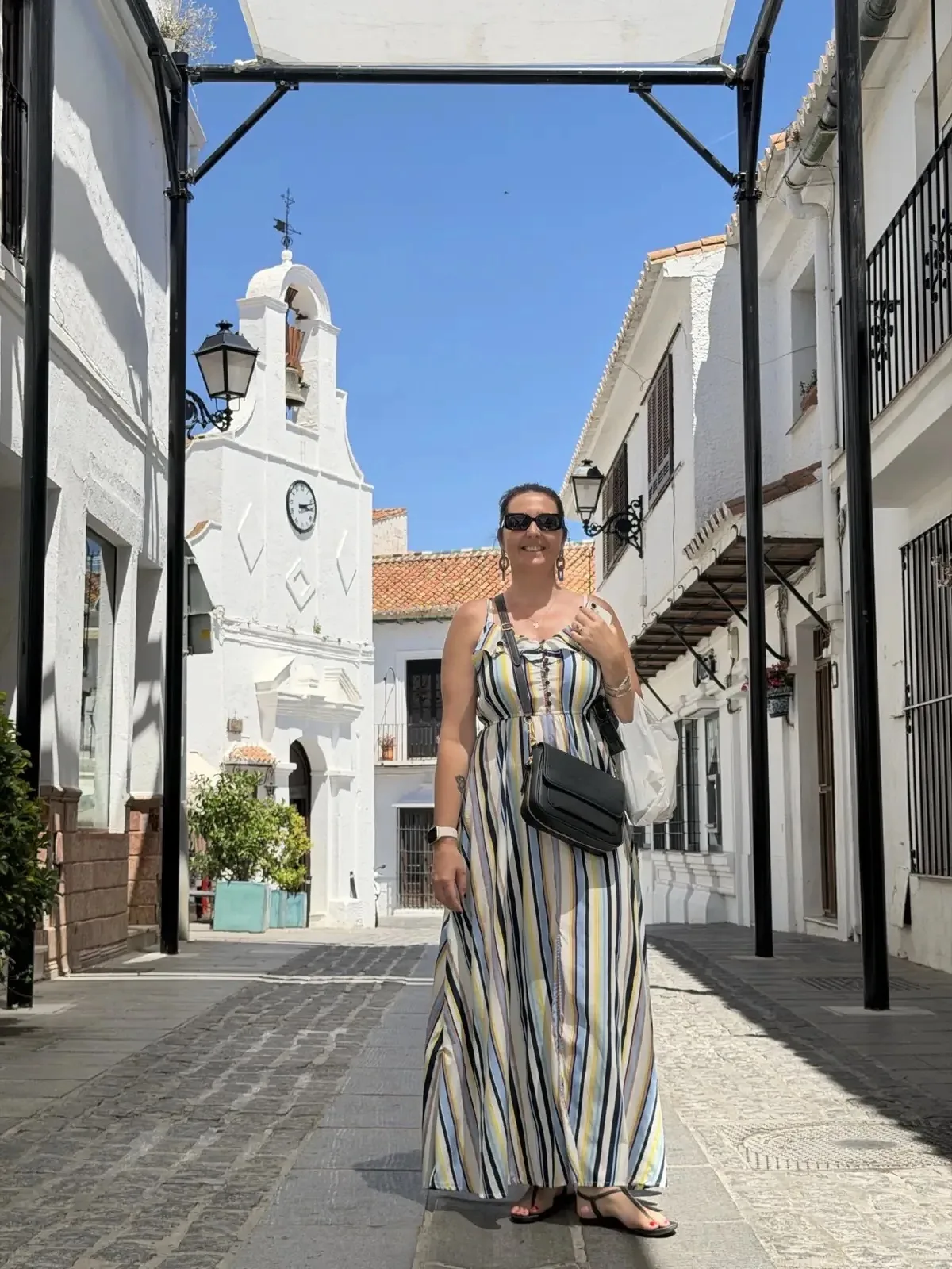 Posing at the covered street with Iglesia San Sebastián in the background