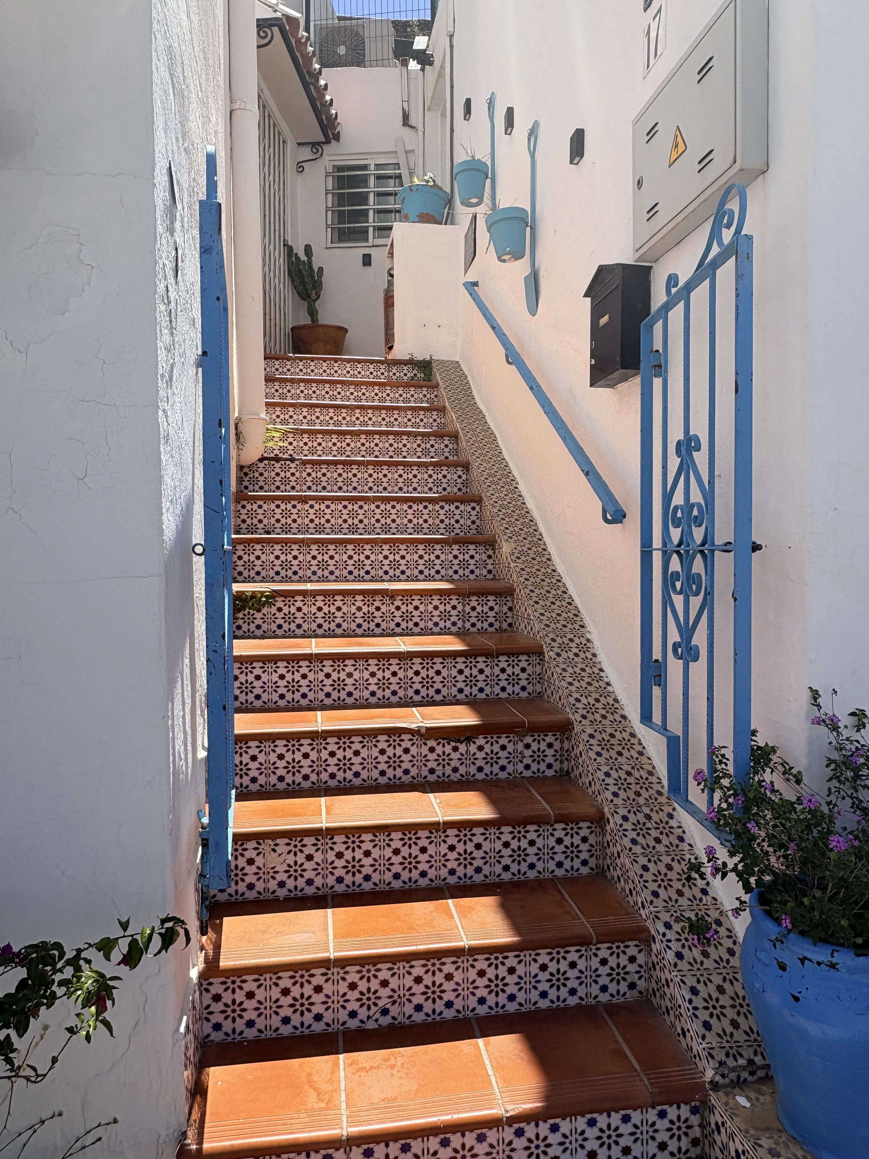 Blue and white tiled building facade in Mijas