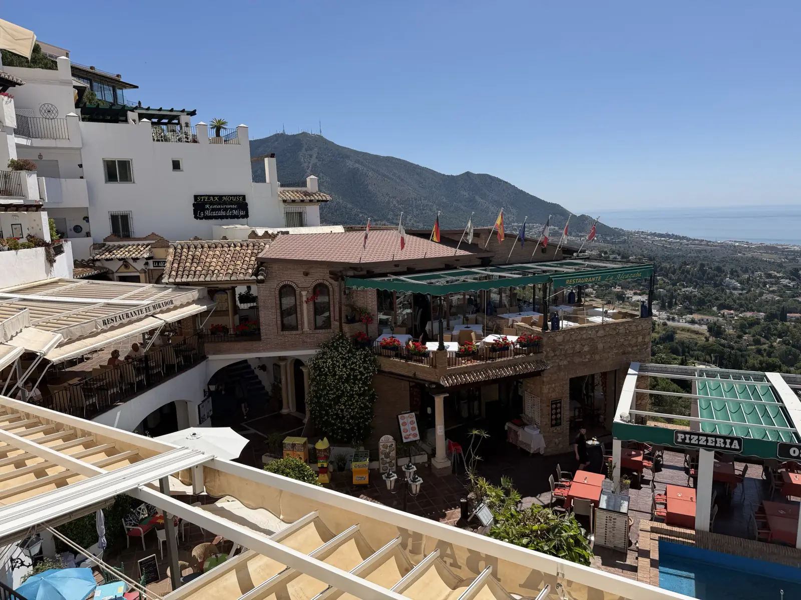 Restaurants in Mijas Pueblo with a view of the coast below