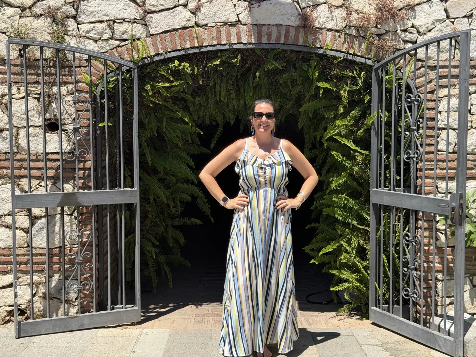 Posing in front of the cave entrance to the Santuario de la Virgen de la Peña in Mijas Pueblo