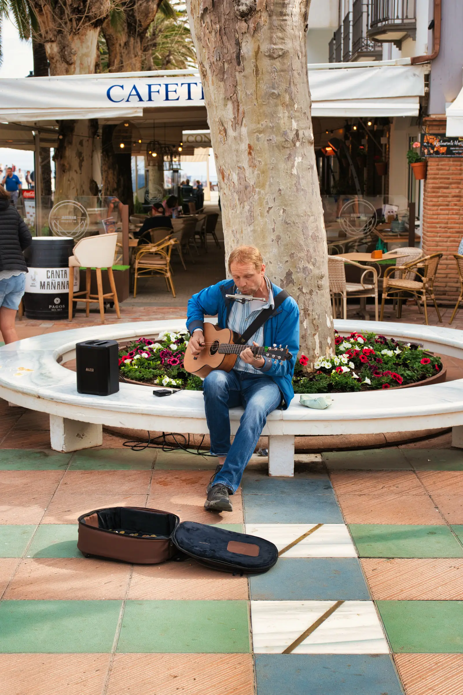 A man busking in Nerja plaza.