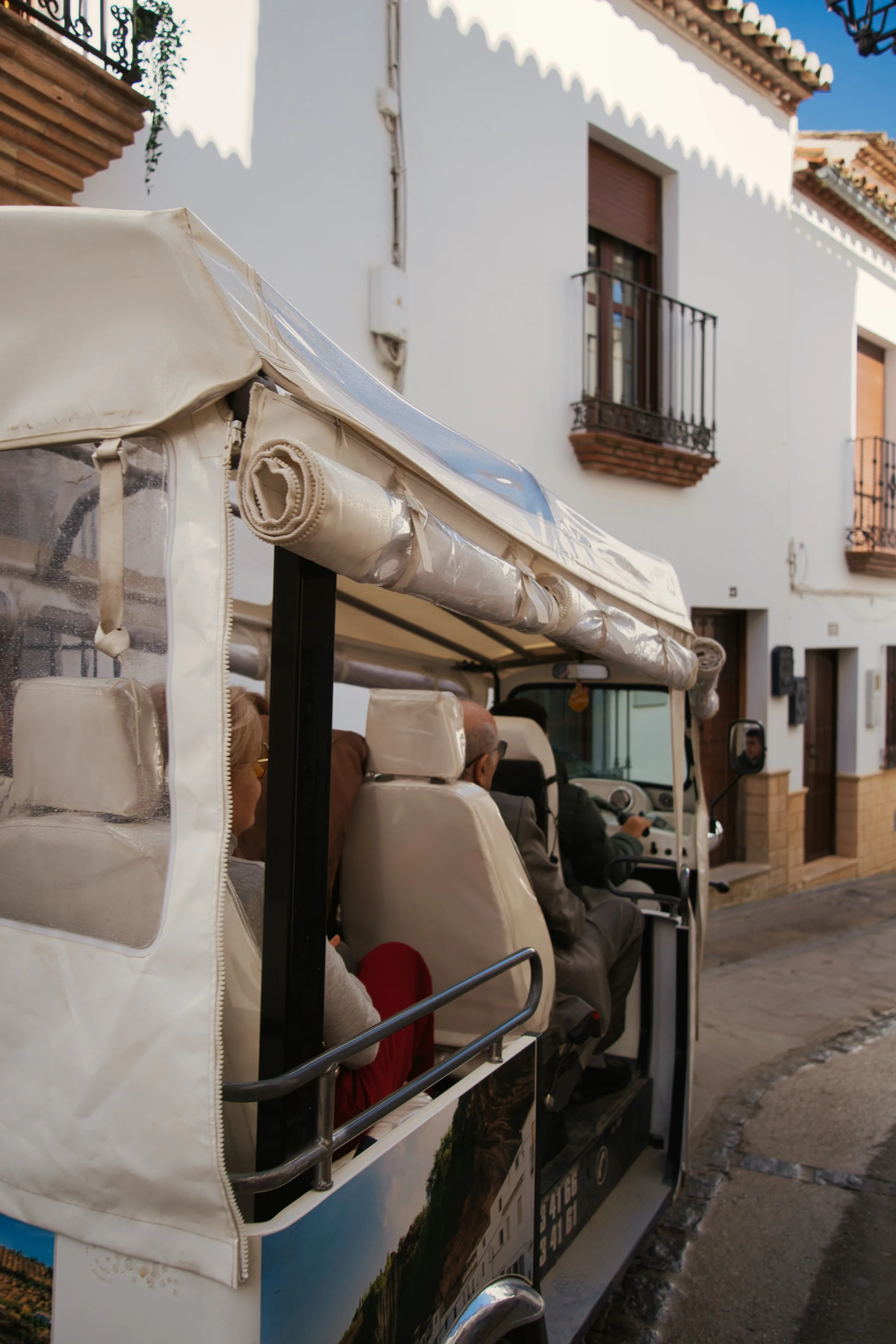 People riding in a taxi.