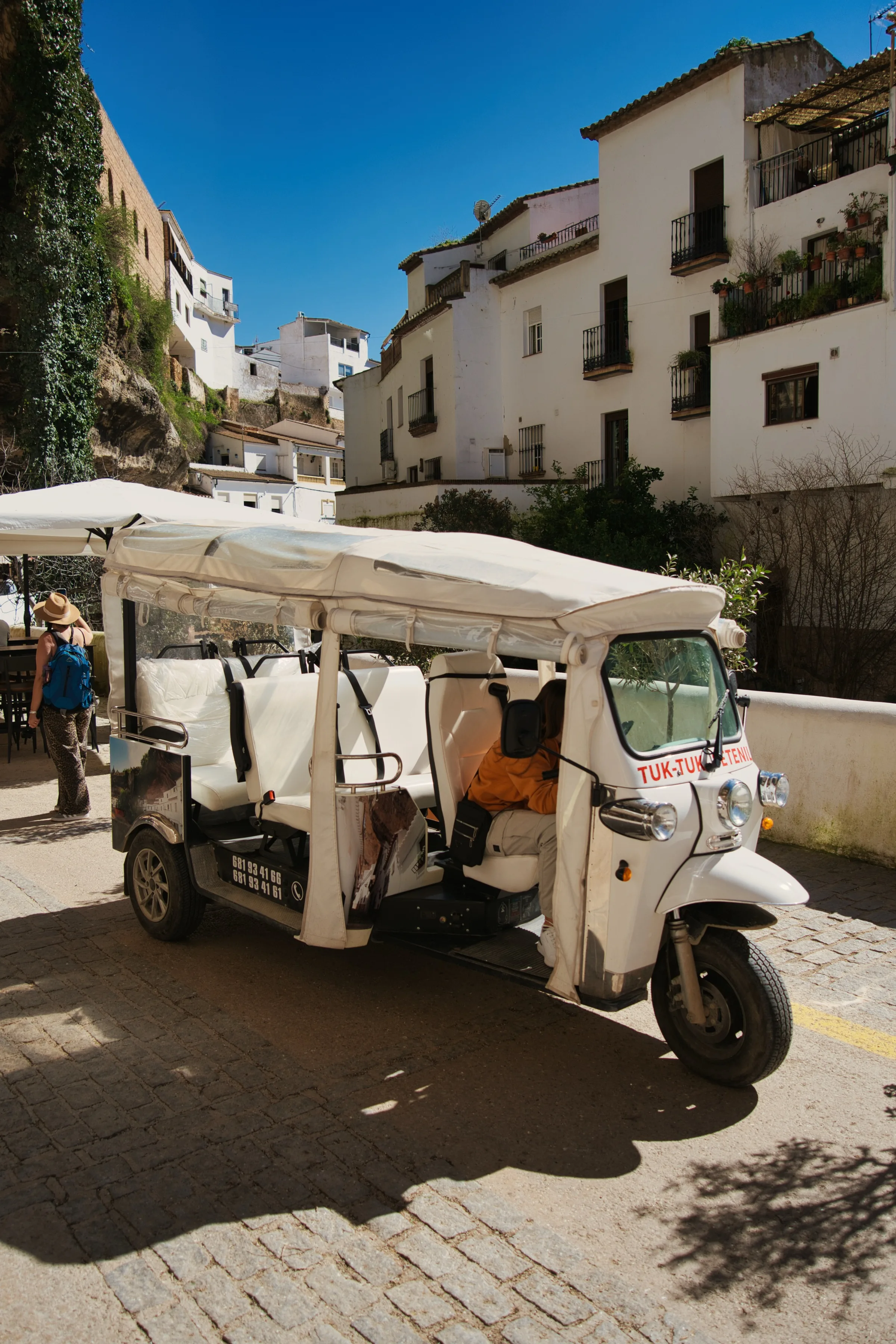 woman walking down a road.
