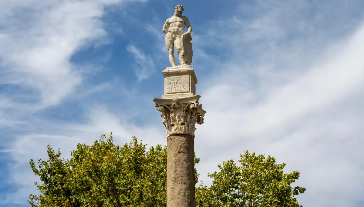 Roman column topped with a statue of Hercules at Alameda de Hercules square