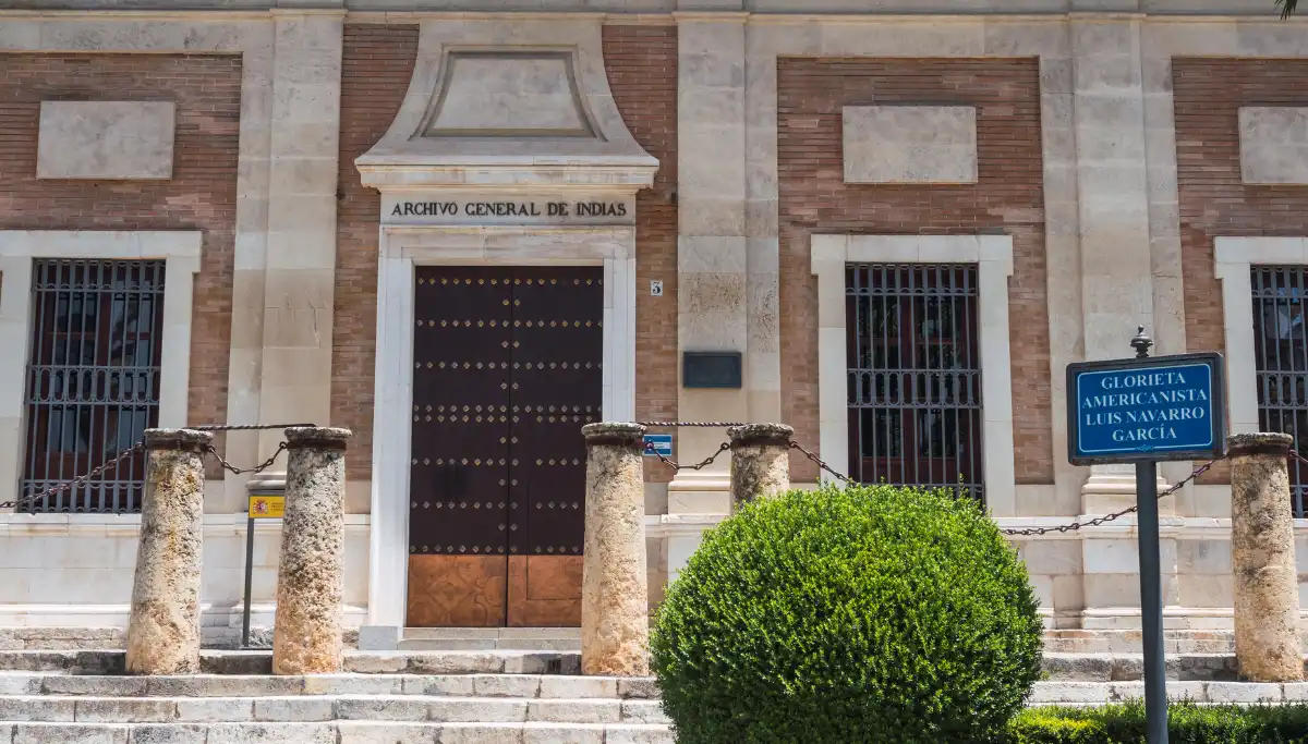 The stone facade and entrance of the Archivo General de Indias in Seville