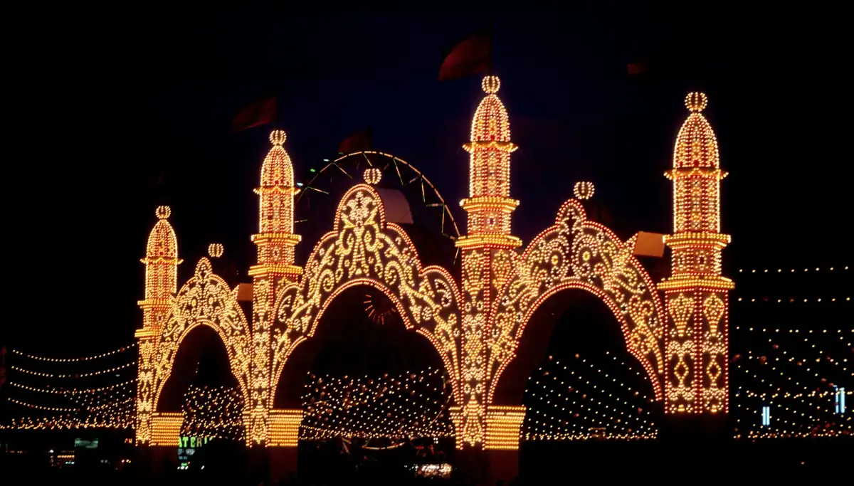 Feria de Abril Portada illuminated at night for the Alumbrado opening ceremony