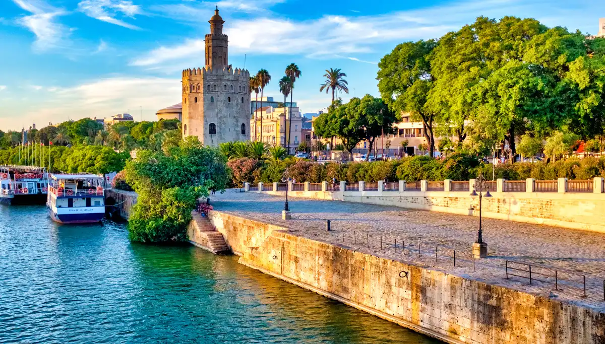 Torre del Oro and the Guadalquivir riverside path on a sunny day in Seville